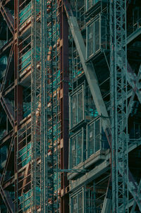 Low angle view of scaffold of modern buildings in city