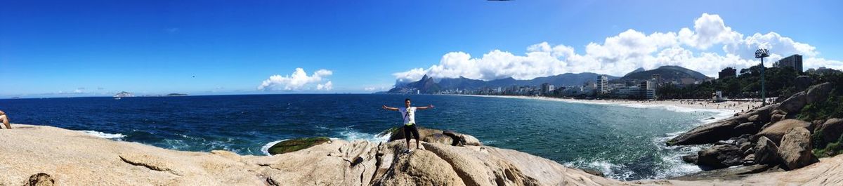 Panoramic view of sea against blue sky