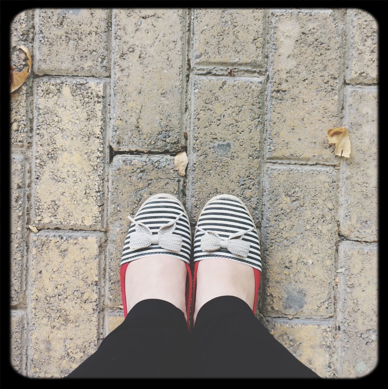 transfer print, low section, shoe, person, auto post production filter, high angle view, footwear, personal perspective, standing, tiled floor, human foot, street, cobblestone, pattern, day, close-up, paving stone