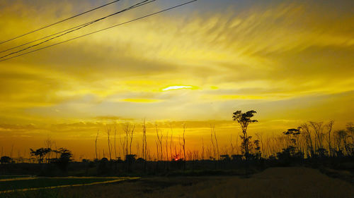 Scenic view of dramatic sky during sunset