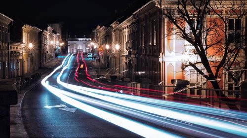 Light trails on road in city at night