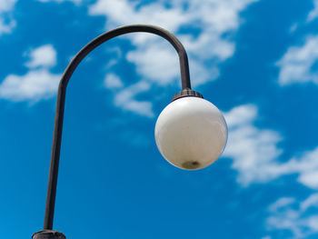 Low angle view of street light against sky