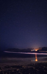 Scenic view of sea against sky at night