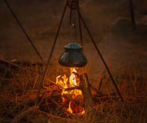 Near the woodland, cooking supper over a campfire. a night of camping