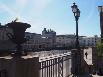 Street light by buildings in city