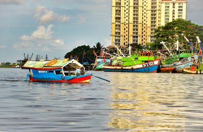 Boat moored on sea against sky