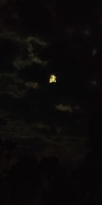 Low angle view of moon in sky at night