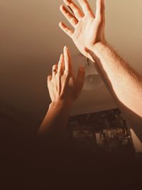 Cropped image of people on hands
