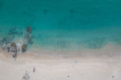 High angle view of people swimming in sea
