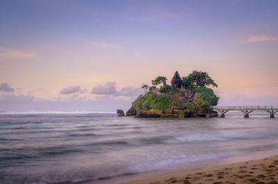 Morning view of pura amerta jati temple on the ismoyo island, at balekambang beach, indonesia.