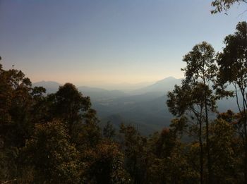 Scenic view of mountains against sky at sunset