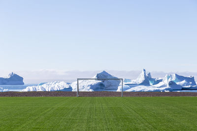 Scenic view of field against sky during winter