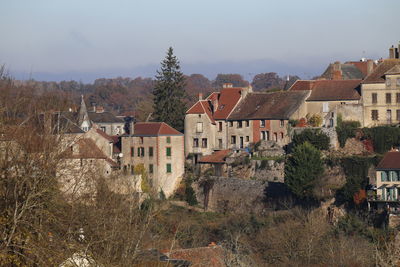 Buildings in city against sky