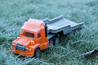 Close-up of toy truck on grassy field