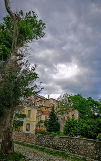 Houses in town against sky