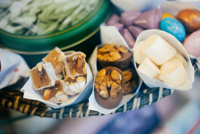 High angle view of dessert in basket on table