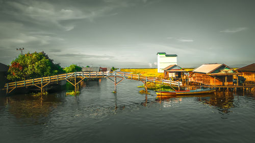 Scenic view of bridge over river against sky