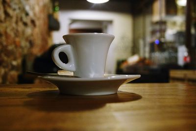 Close-up of coffee cup on table