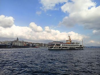 Scenic view of sea against sky in city