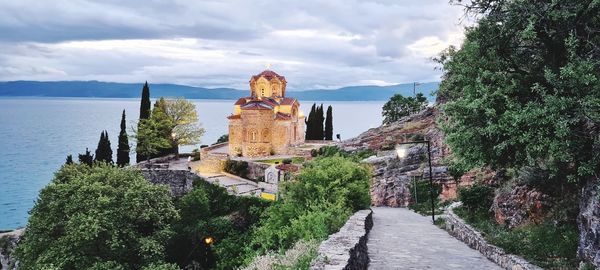 Panoramic view of temple amidst buildings against sky