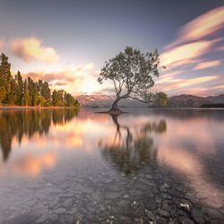 Scenic view of lake against sky during sunset