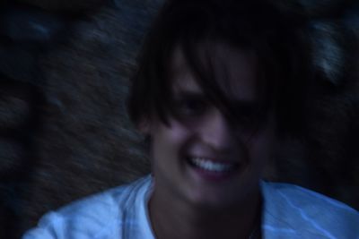 Close-up portrait of smiling young man