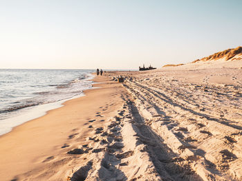 Scenic view of beach against clear sky