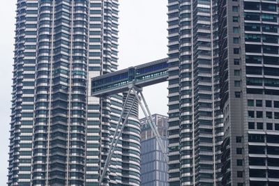 Low angle view of modern buildings against sky