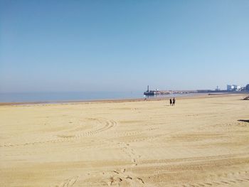 Scenic view of beach against clear sky