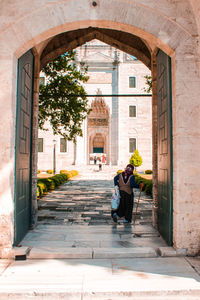 Woman walking on suleymaniye mosque
