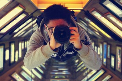 Directly above shot of man taking picture from camera