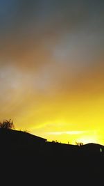 Silhouette of trees against sky during sunset