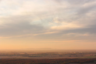 Scenic view of landscape against sky during sunset