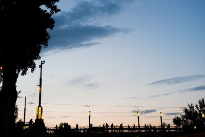 Low angle view of silhouette trees against sky at sunset