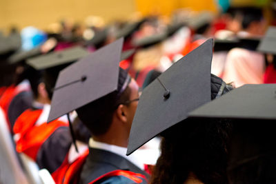 Students wearing mortarboard during graduation ceremony