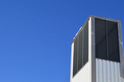 Low angle view of building against blue sky