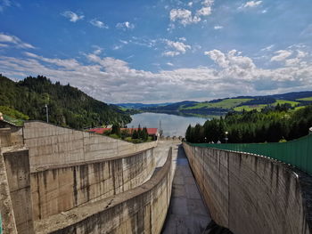 Water drain from the dam onto lake czorsztyn. the gorce and pieniny mountains czorsztyn poland.