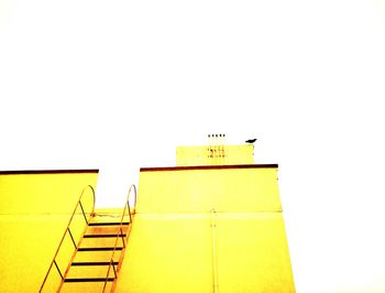 Low angle view of yellow structure against clear sky