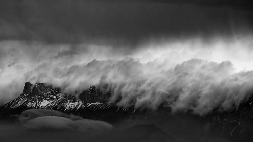 Scenic view of mountains against sky during winter