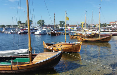 Boats moored at harbor