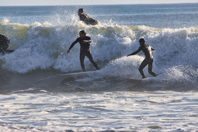 People enjoying in sea