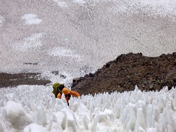 Man with umbrella on snow