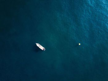 High angle view of boat sailing in sea against sky