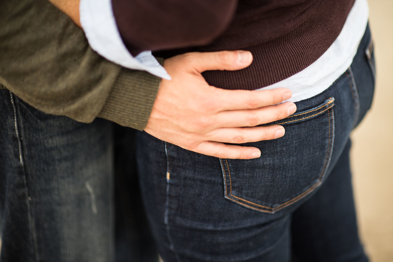 person, midsection, lifestyles, men, holding, part of, indoors, close-up, leisure activity, mid section, casual clothing, standing, focus on foreground, human finger