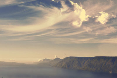 Scenic view of mountains against sky during sunset