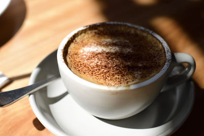 Close-up of coffee cup on table