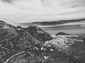 High angle shot of countryside landscape against clouds