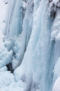 Scenic view of snow covered waterfall