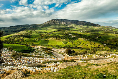 Scenic view of landscape and mountains against sky