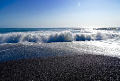 Scenic view of sea against clear blue sky